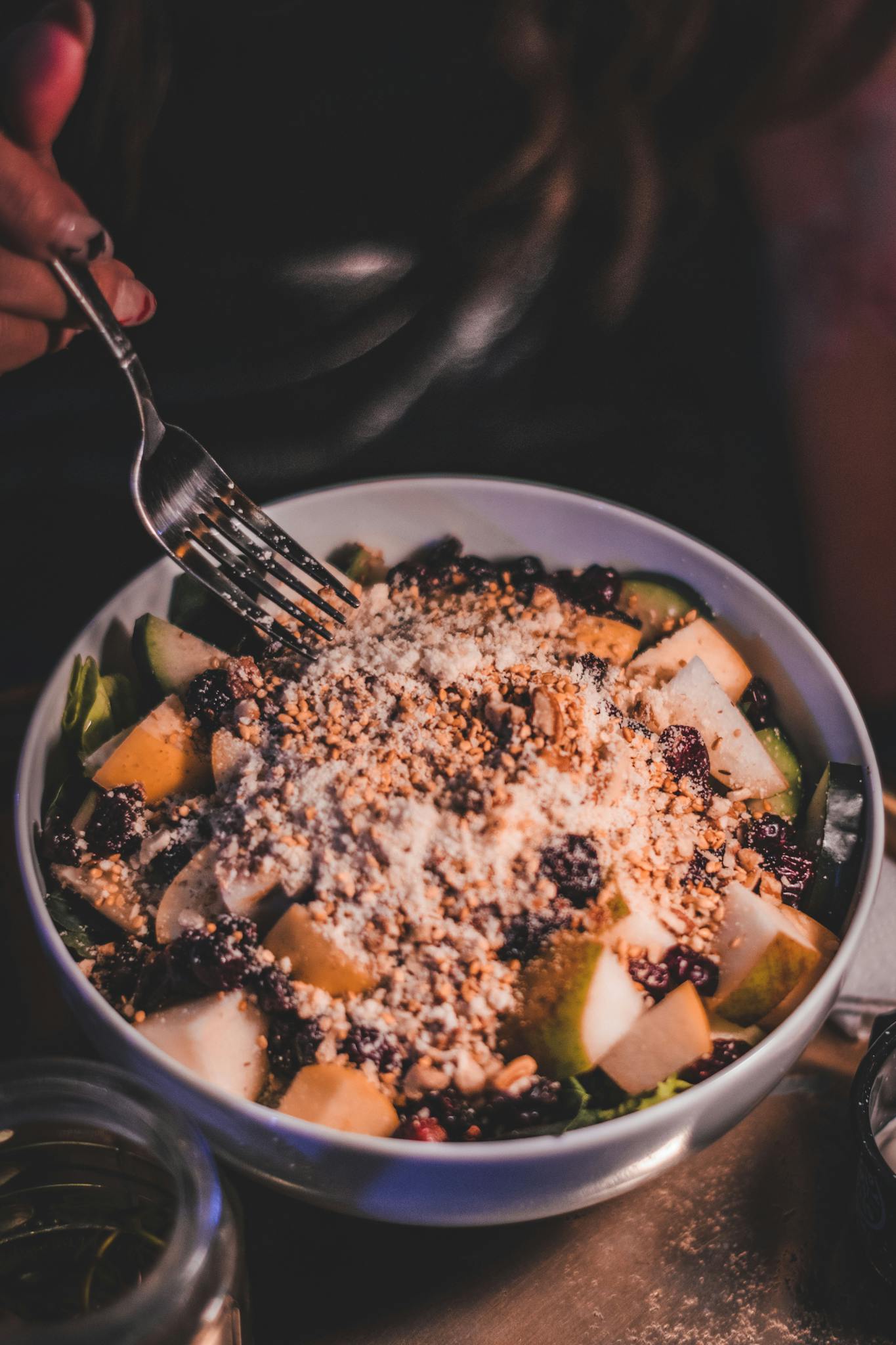 A vibrant salad with pears, nuts, and greens, perfect for a nutritious meal.